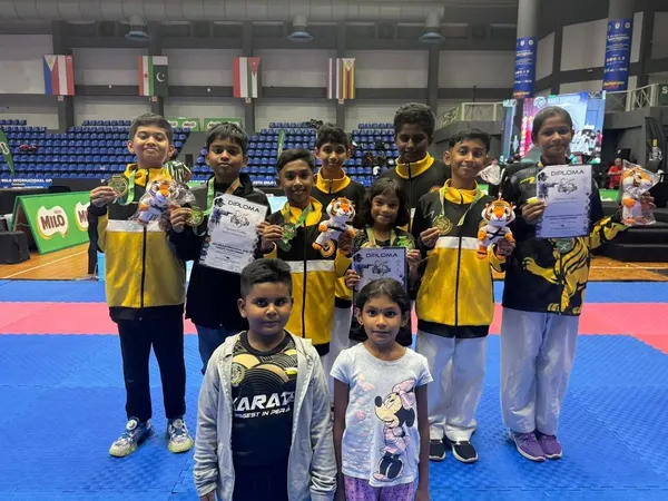 Perak Legends students lined up with their medals and certificates in the arena